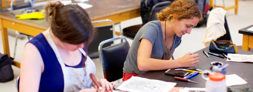 Two art students at work