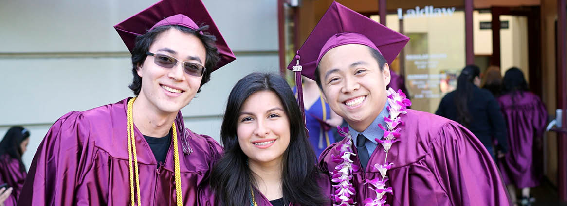 Three Grads Smiling