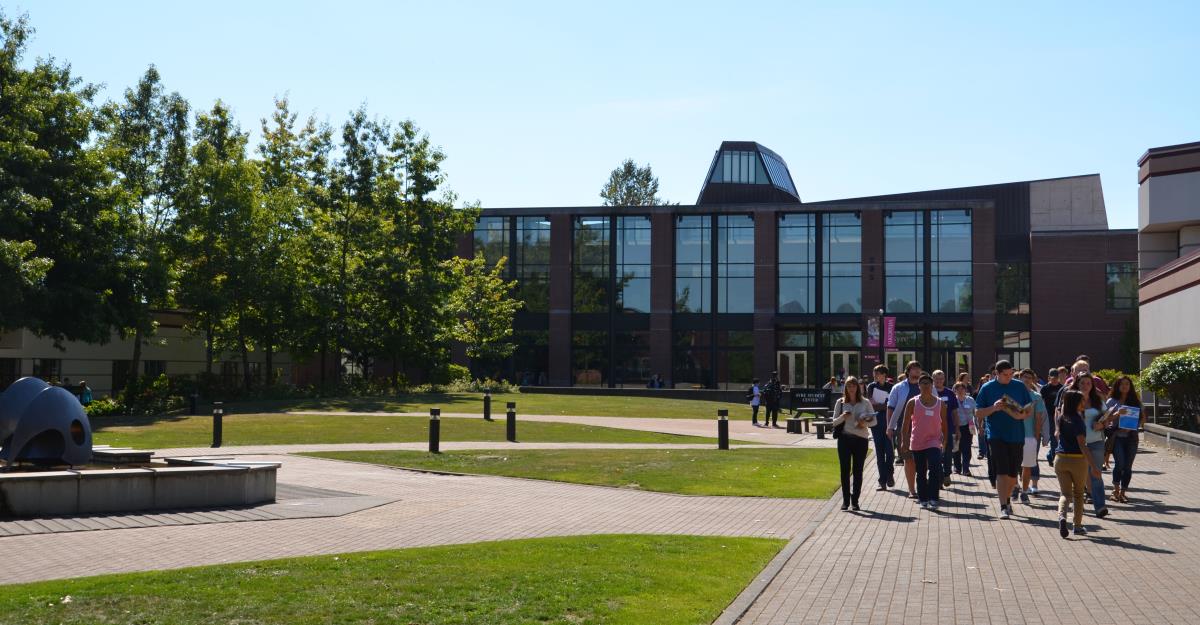 a group of students participating in a campus tour on wcc's campus