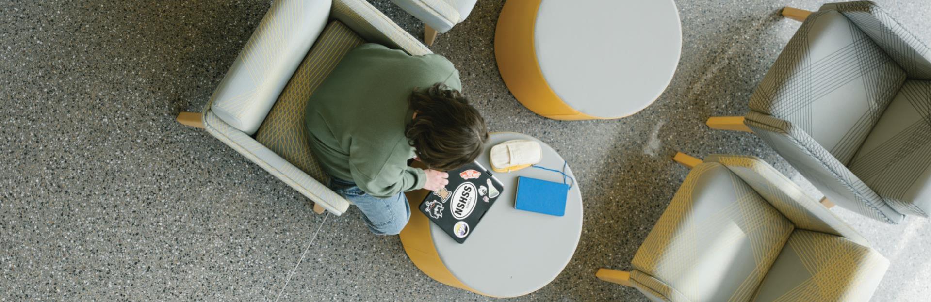 Birds eye view of a WCC student studying in the Learning Commons