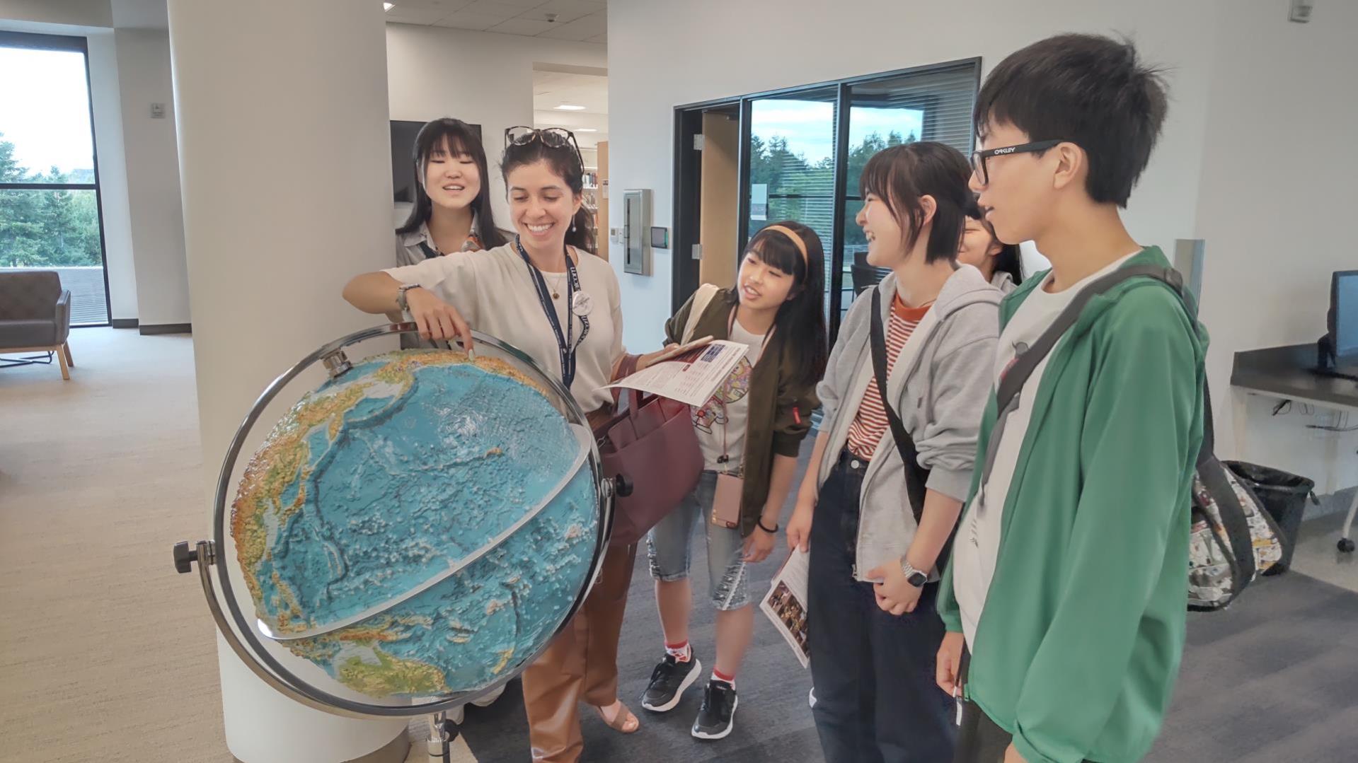 WCC staff with international programs looking at globe