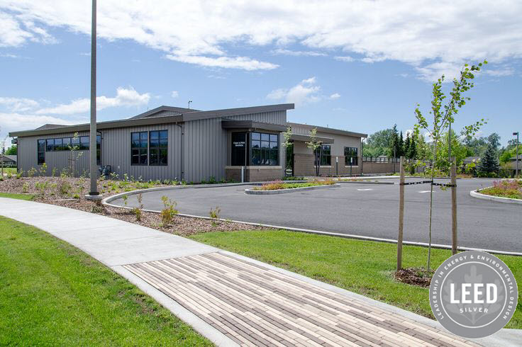 Auxiliary Services Building with front driveway and curved walking path in front