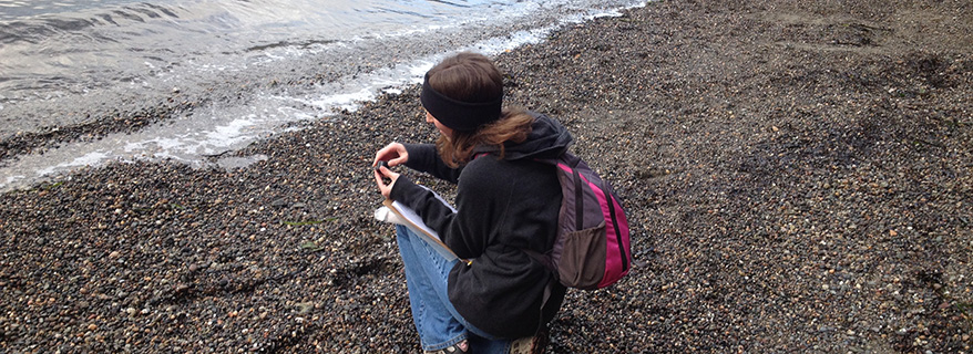 Student examining rock